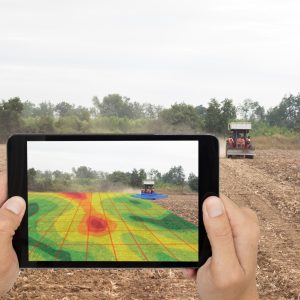smart agriculture concept, farmer use tablet read infrared in tractor with high definition soil mapping while planting,conduct deep soil scan during a tillage pass include organic, ec,om,Nitrogen,seed